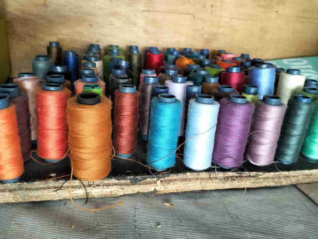 Colorful threads at Manado's textile market in the Presiden Building